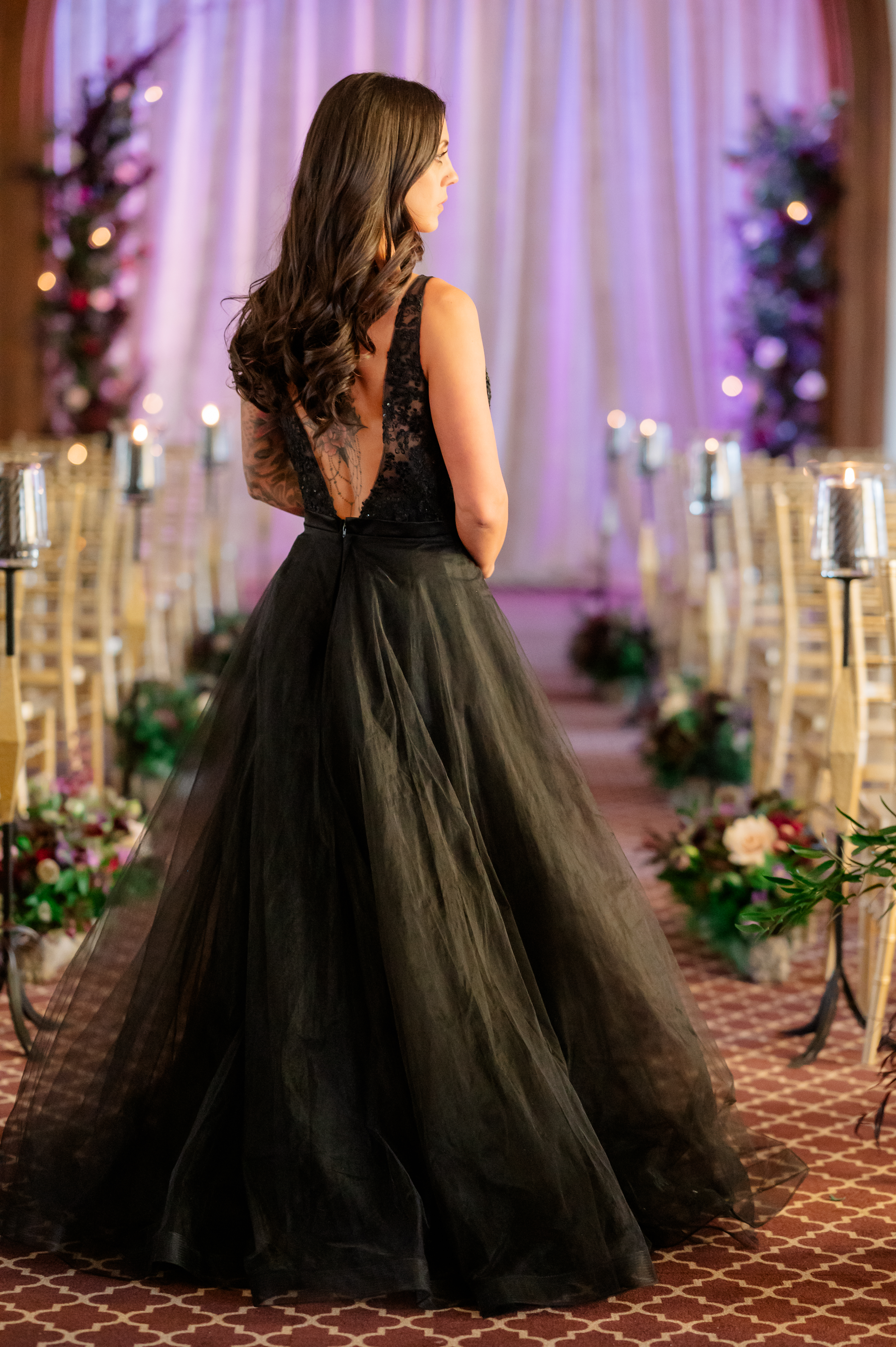 "Stunning bride adorned in a chic black wedding gown, radiating elegance and modern sophistication on her special day."